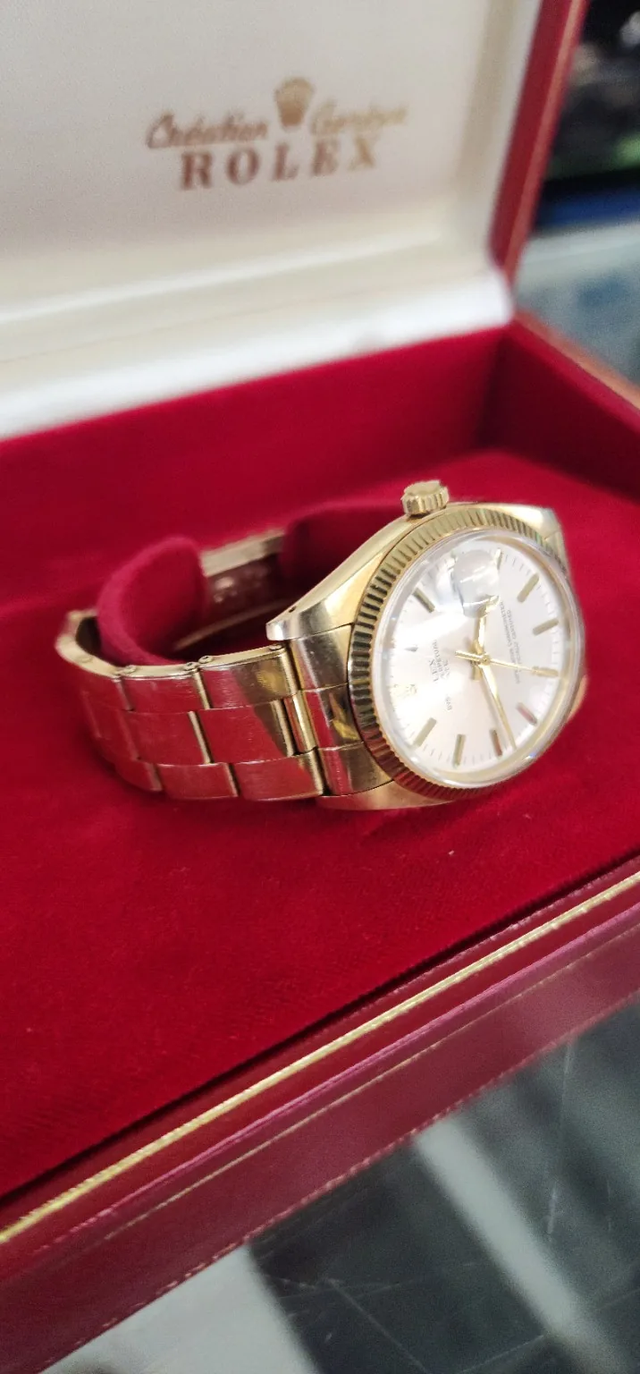 Watch displayed in a red case